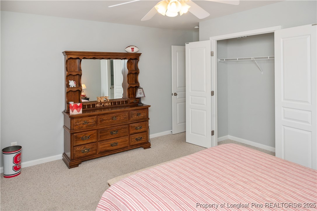 5229 Moonview Court Raleigh, NC 27606 - Photo 23 of 38 a bedroom with a bed and a dresser