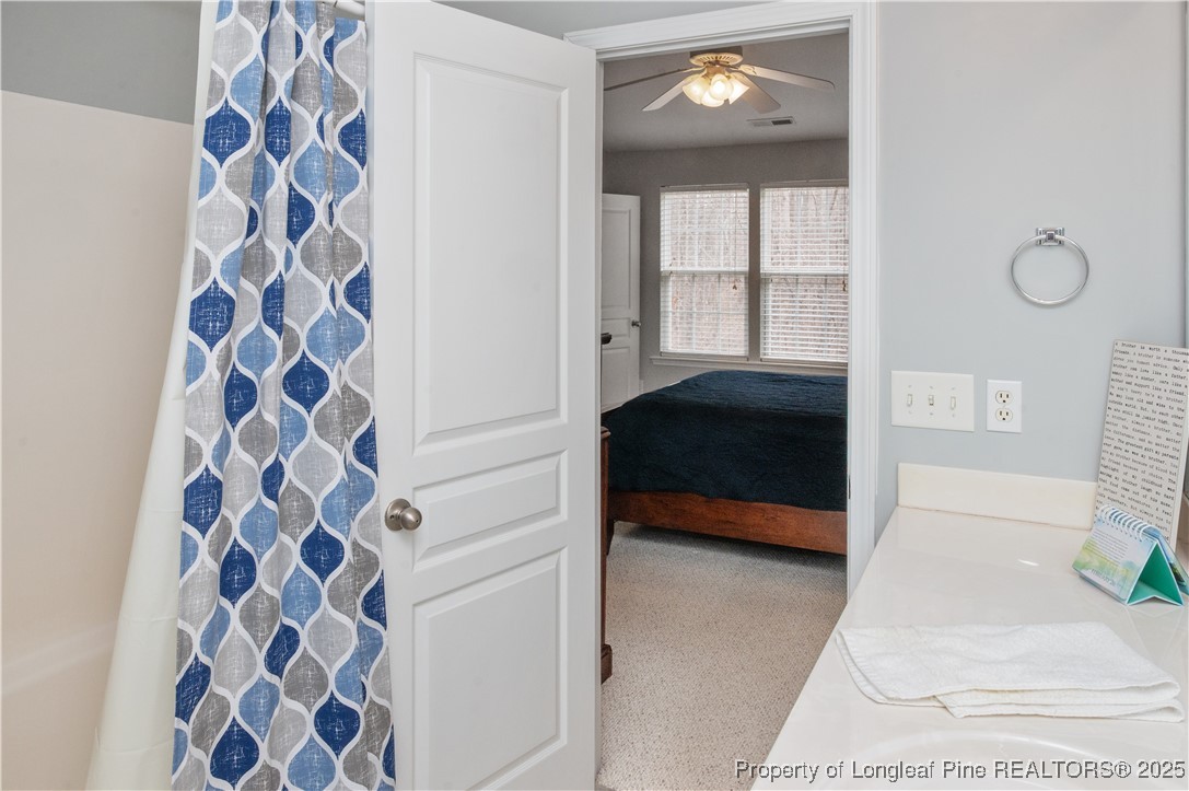 5229 Moonview Court Raleigh, NC 27606 - Photo 24 of 38 a bedroom with a bed and a window