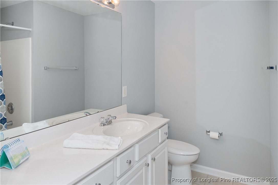 5229 Moonview Court Raleigh, NC 27606 - Photo 25 of 38 a bathroom with a sink and a toilet