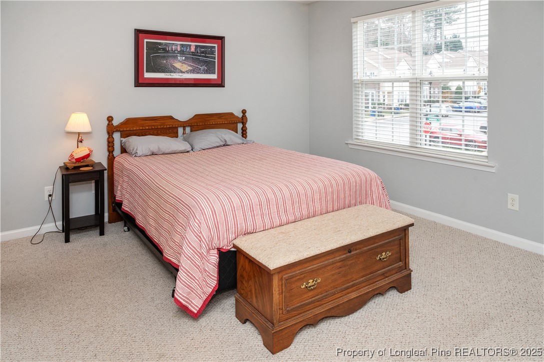 5229 Moonview Court Raleigh, NC 27606 - Photo 26 of 38 a bedroom with a bed and a window