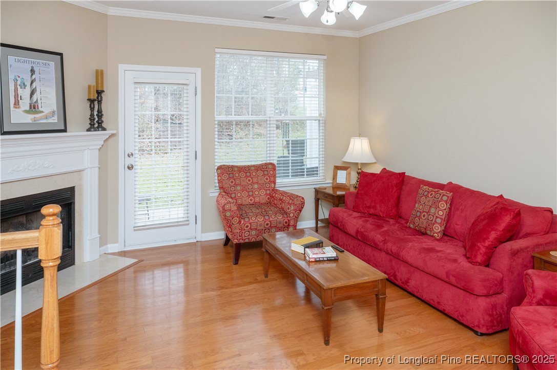 5229 Moonview Court Raleigh, NC 27606 - Photo 8 of 38 a living room with furniture and a fireplace