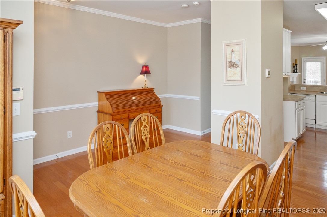 5229 Moonview Court Raleigh, NC 27606 - Photo 9 of 38 a bedroom with a bed and a chandelier