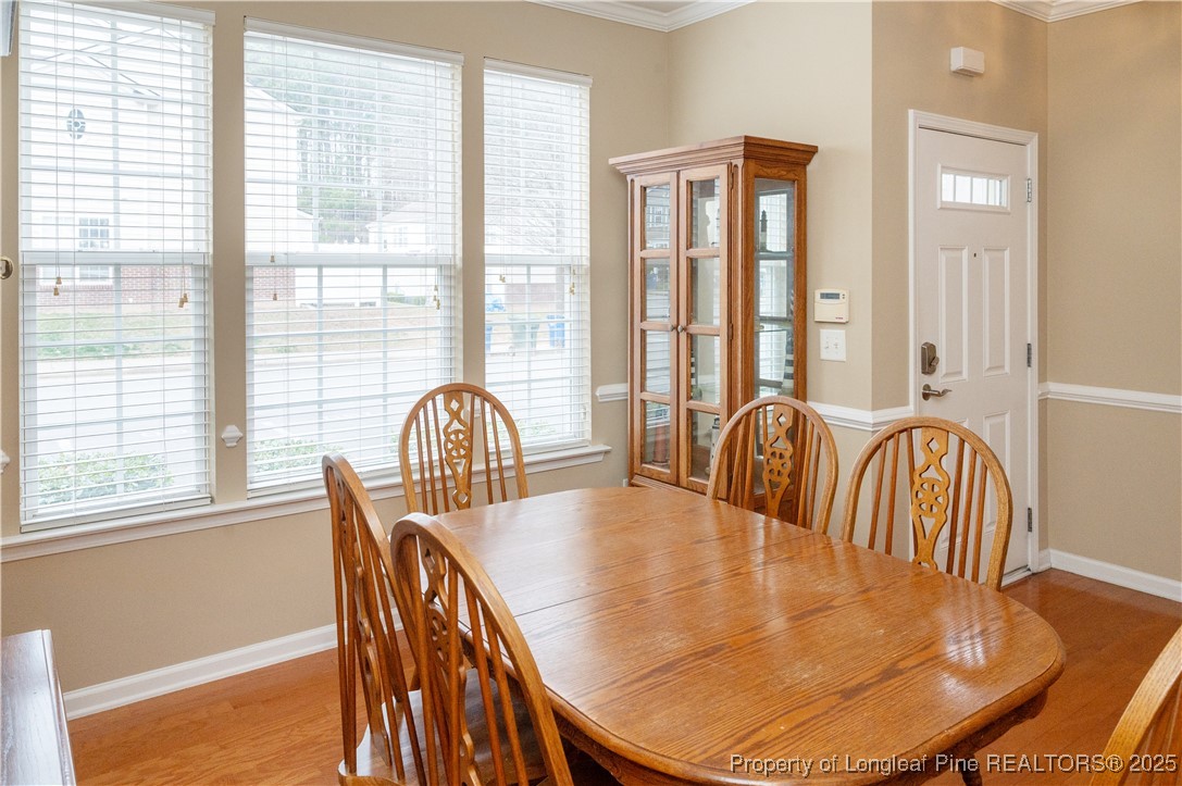 5229 Moonview Court Raleigh, NC 27606 - Photo 10 of 38 a view of a dining room with furniture window and wooden floor