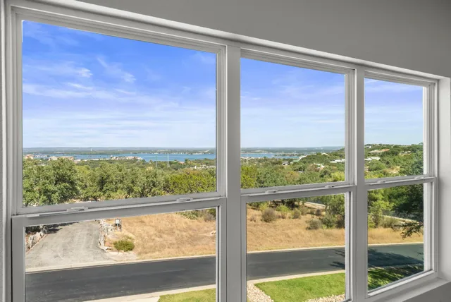 a bathroom with a shower sink and mirror