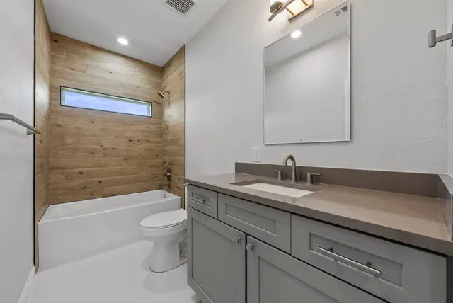 a view of workspace with wooden floor and ceiling fan