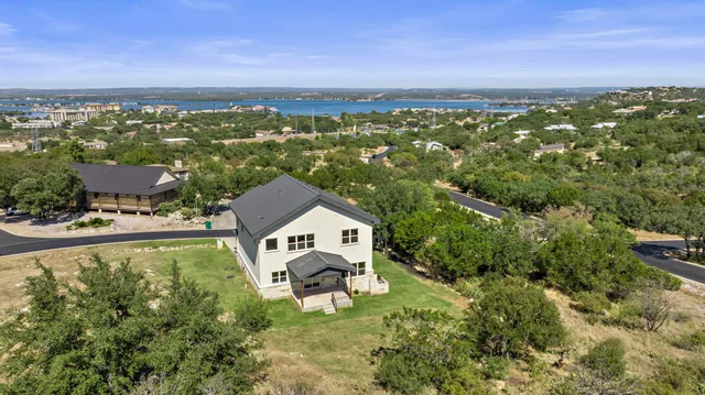 a view of a park with large trees