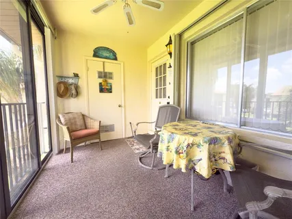 a view of a backyard with sitting area