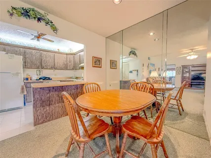 a kitchen with a stove sink and cabinets