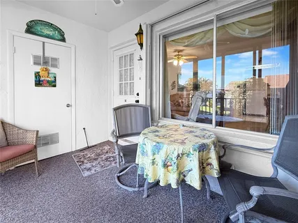 a view of a backyard with sitting area