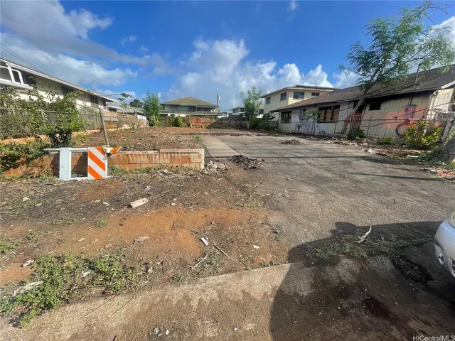 a view of a street with a yard and a fountain