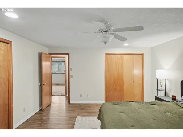 a view of an empty room and wooden floor