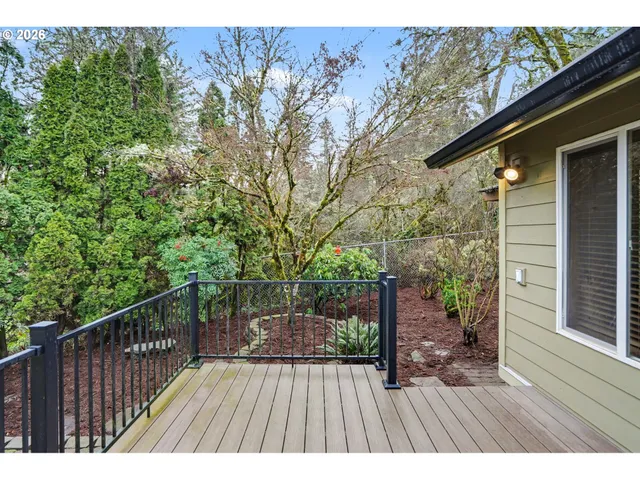 a view of balcony with wooden floor