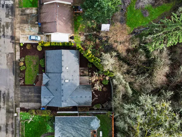 an aerial view of a house with a yard