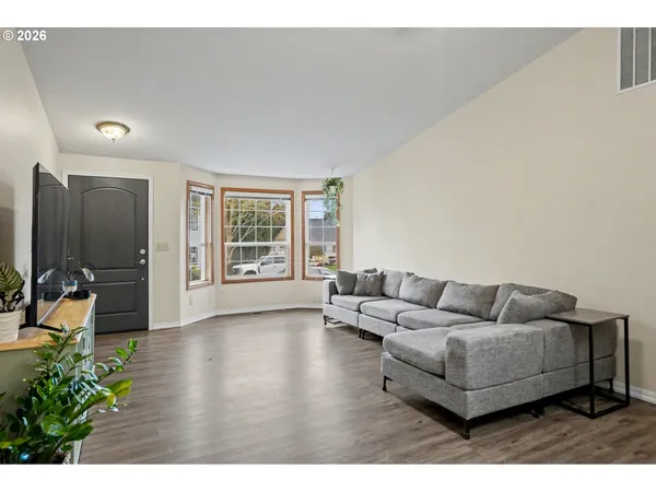 a living room with furniture and a large window