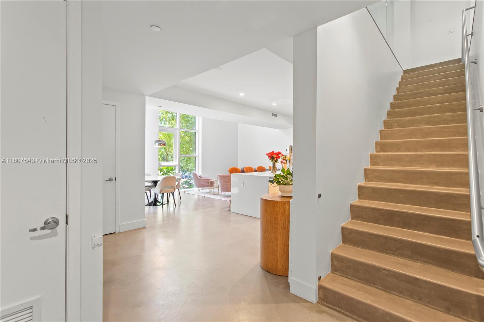 455 Northeast 39th Street, Unit 102 Miami, FL 33137 - Photo 11 of 32 a view of entryway and hall with wooden floor