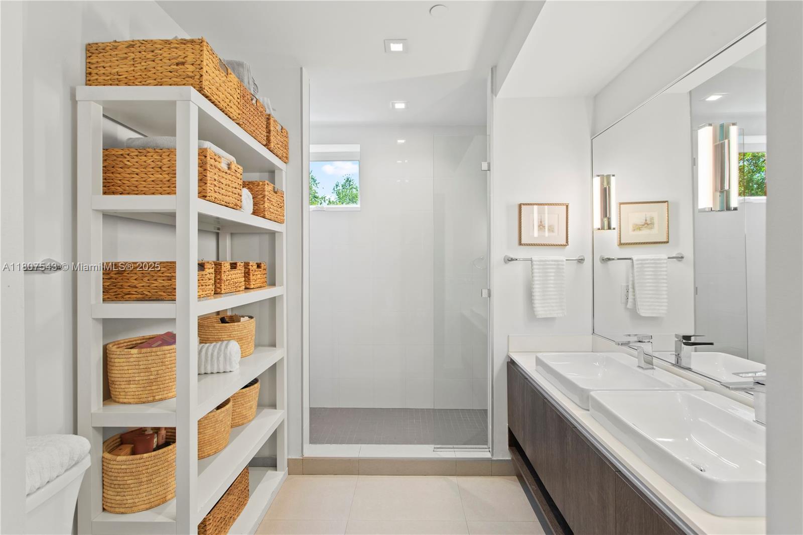 455 Northeast 39th Street, Unit 102 Miami, FL 33137 - Photo 19 of 32 a bathroom with a sink a toilet and shower