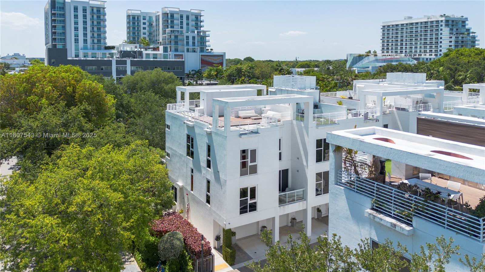 455 Northeast 39th Street, Unit 102 Miami, FL 33137 - Photo 30 of 32 a large building with a clock tower in the middle
