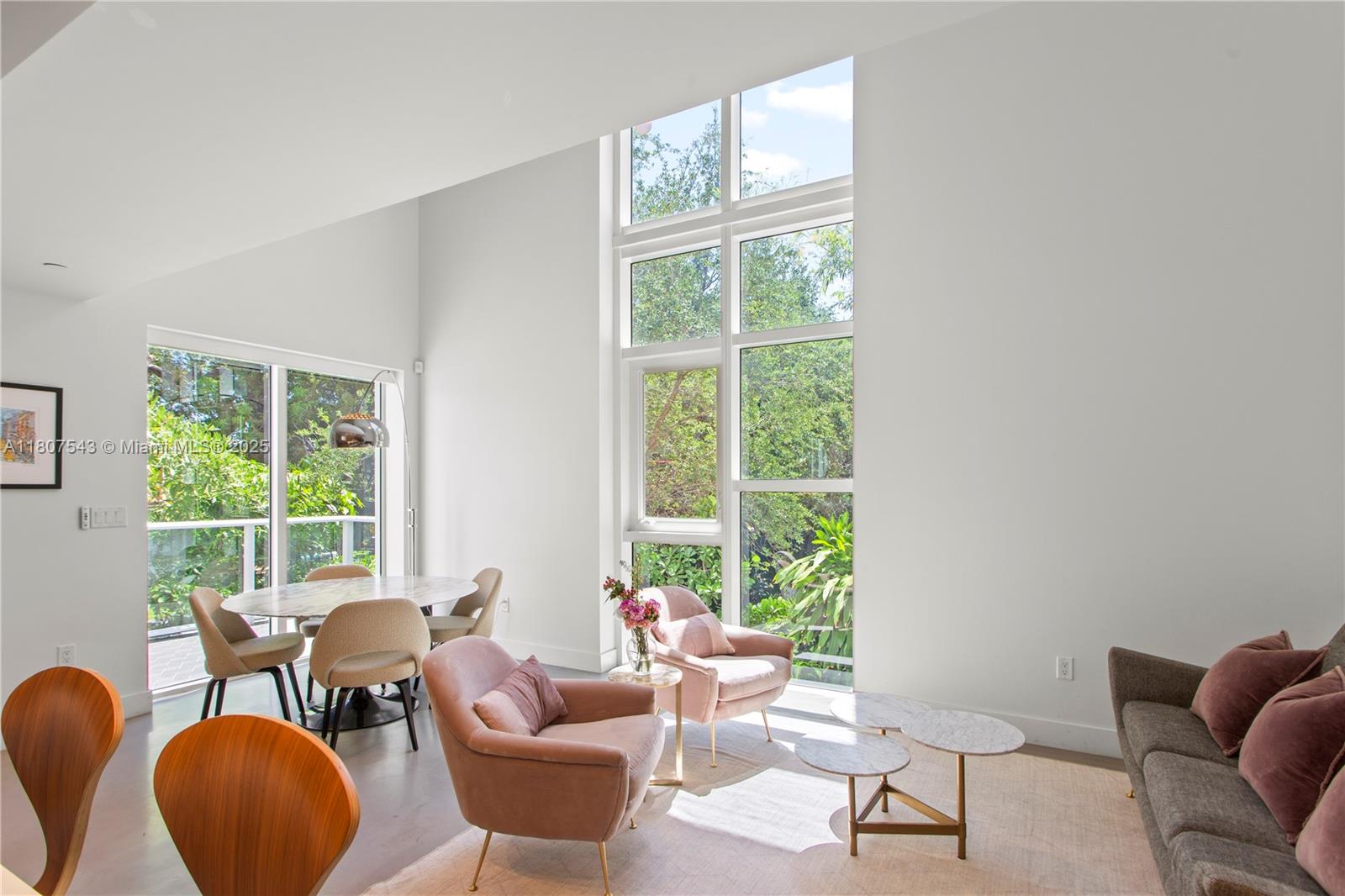 455 Northeast 39th Street, Unit 102 Miami, FL 33137 - Photo 7 of 32 a living room with furniture and a window