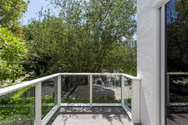 a view of small yard from a balcony