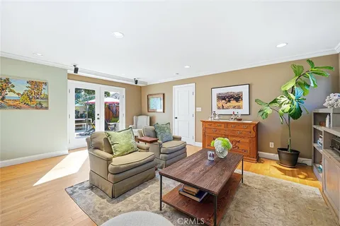 a living room with furniture rug and window