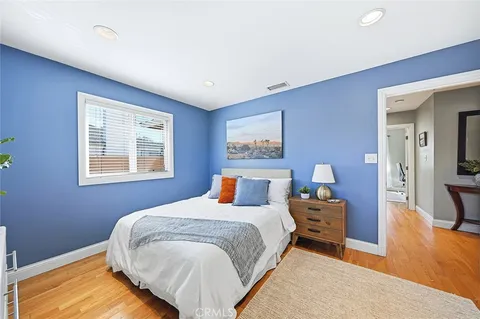 a bedroom with bed and a window
