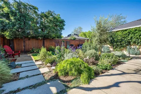 a view of a garden with chairs