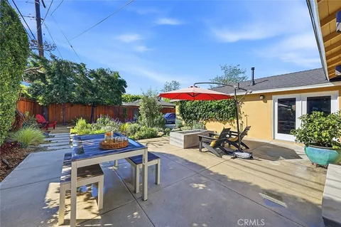 a view of a dining tables and chairs in a patio