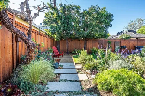 a garden with flowers in front of it