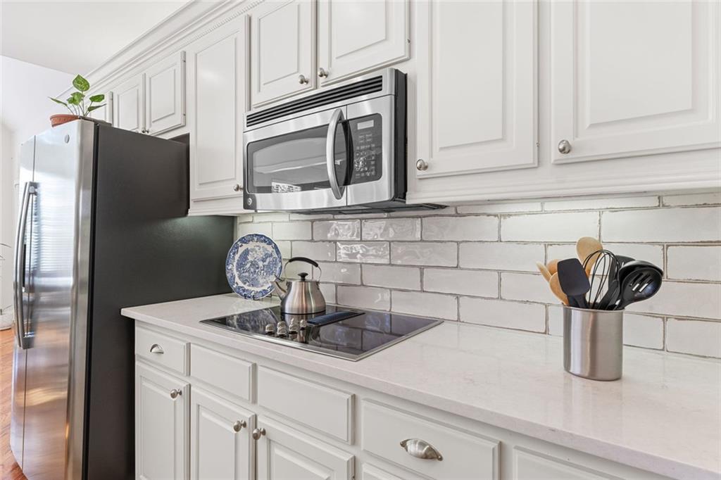 1476 Annapolis Way Grayson, GA 30017 - Photo 12 of 51 a kitchen with appliances and cabinets