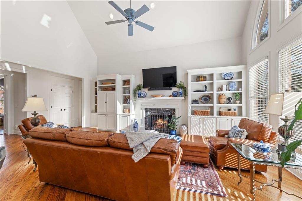 1476 Annapolis Way Grayson, GA 30017 - Photo 20 of 51 a living room with furniture a flat screen tv and a fireplace