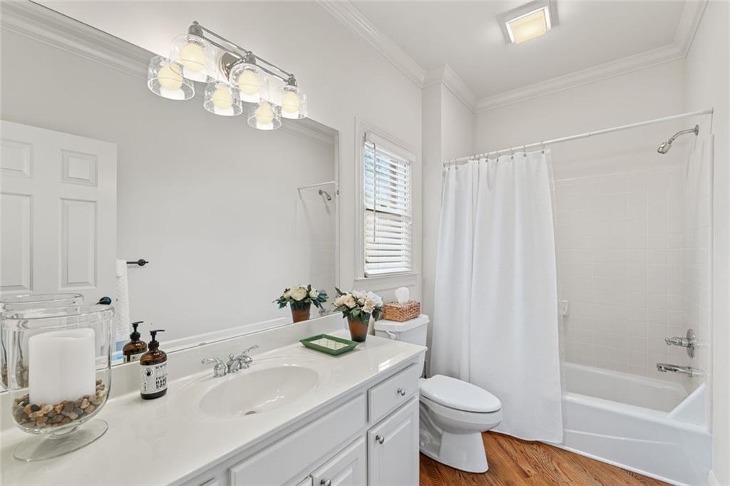 1476 Annapolis Way Grayson, GA 30017 - Photo 23 of 51 a bathroom with a sink toilet and shower