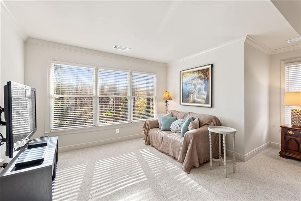 1476 Annapolis Way Grayson, GA 30017 - Photo 28 of 51 a spacious bedroom with a large bed and a large window
