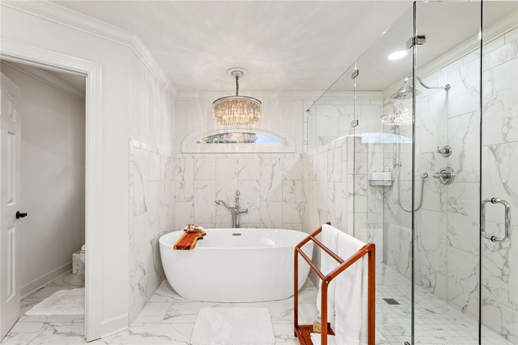 1476 Annapolis Way Grayson, GA 30017 - Photo 29 of 51 a bathroom with a bathtub and shower