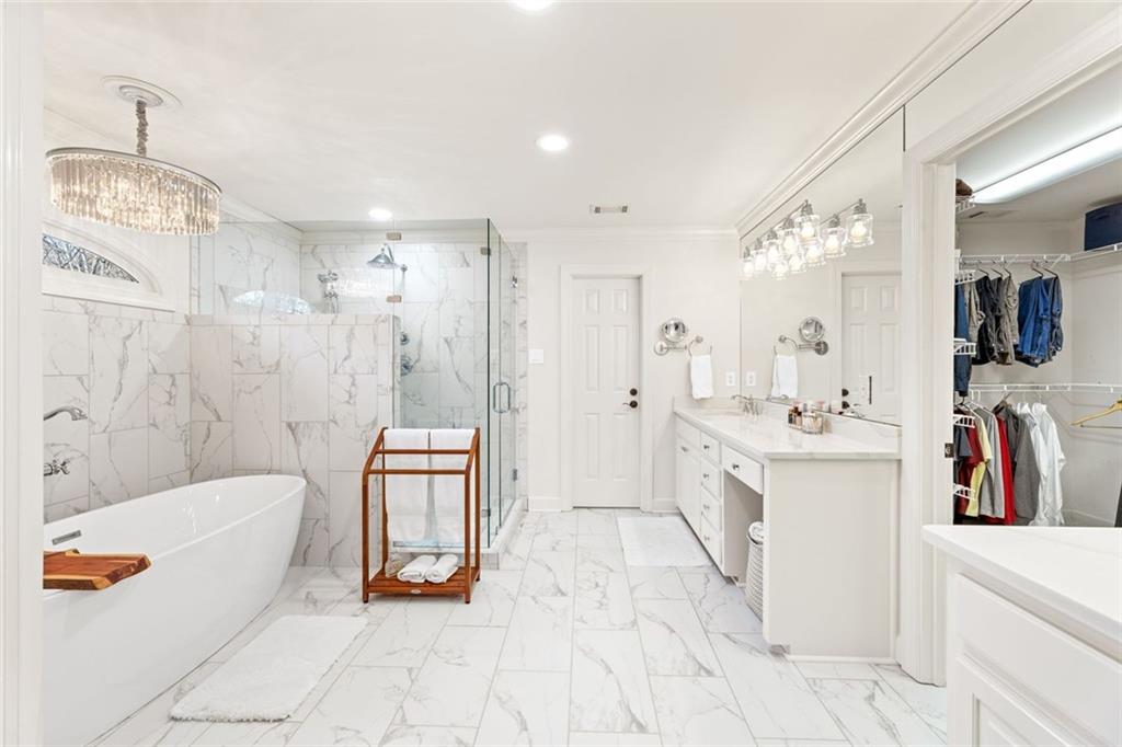 1476 Annapolis Way Grayson, GA 30017 - Photo 30 of 51 a spacious bathroom with a tub sink and mirror