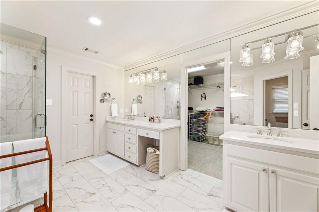 1476 Annapolis Way Grayson, GA 30017 - Photo 31 of 51 a bathroom with a double vanity sink mirror and shower