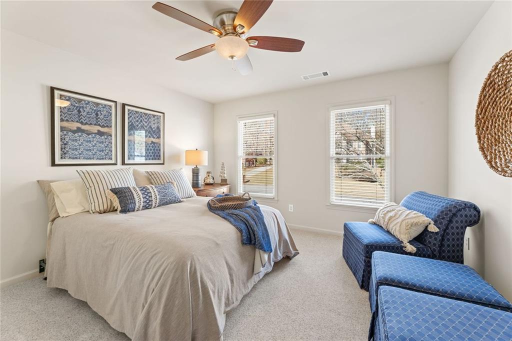 1476 Annapolis Way Grayson, GA 30017 - Photo 34 of 51 a bedroom with bed couch and window