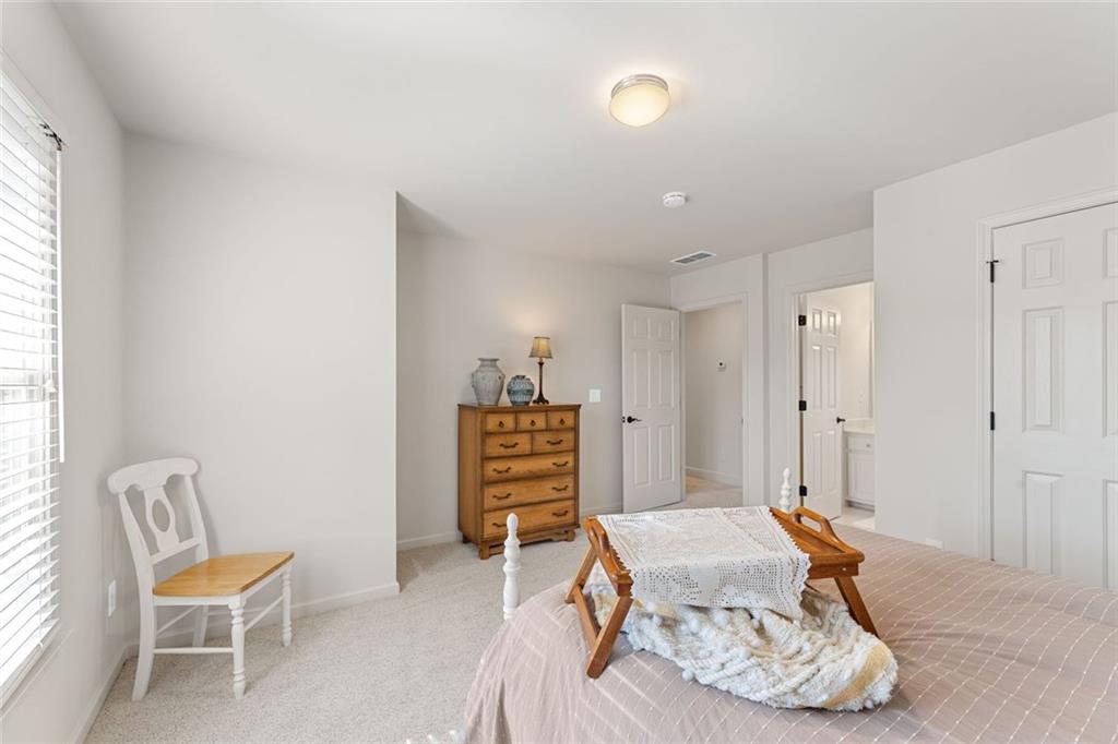 1476 Annapolis Way Grayson, GA 30017 - Photo 37 of 51 a room with a table and chairs