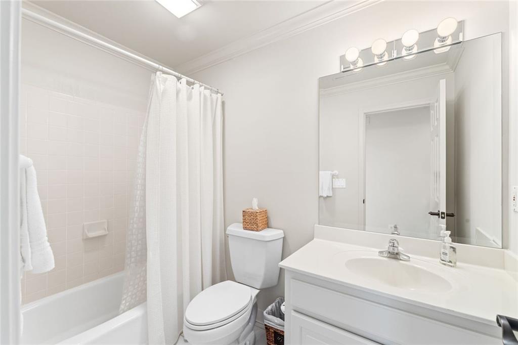 1476 Annapolis Way Grayson, GA 30017 - Photo 40 of 51 a bathroom with a sink a toilet and shower