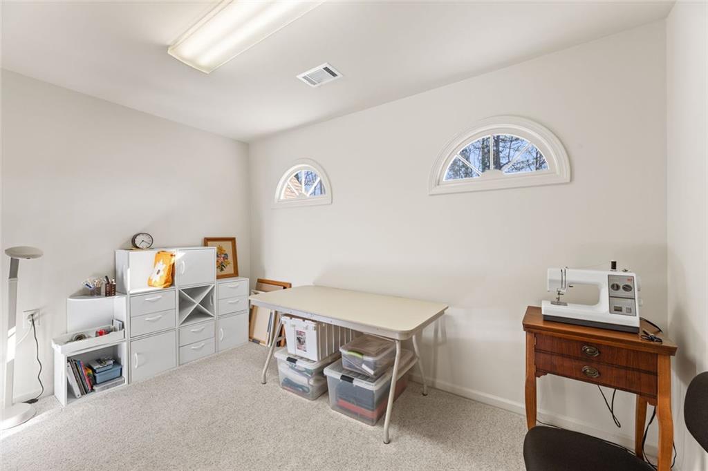 1476 Annapolis Way Grayson, GA 30017 - Photo 41 of 51 a bedroom with furniture and a wooden floor