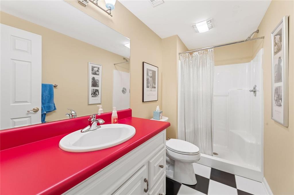 1476 Annapolis Way Grayson, GA 30017 - Photo 45 of 51 a bathroom with a sink and a mirror