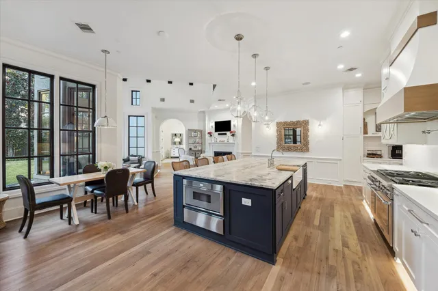 a large kitchen with lots of counter space and stainless steel appliances