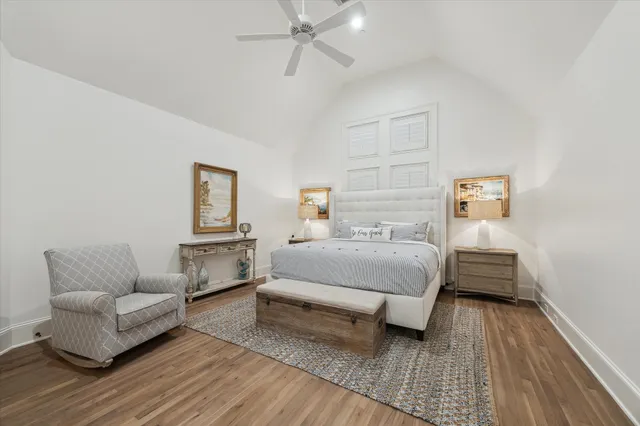 a bedroom with furniture and wooden floor