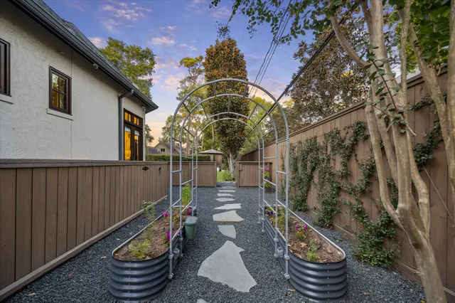 a front view of a house with outdoor seating
