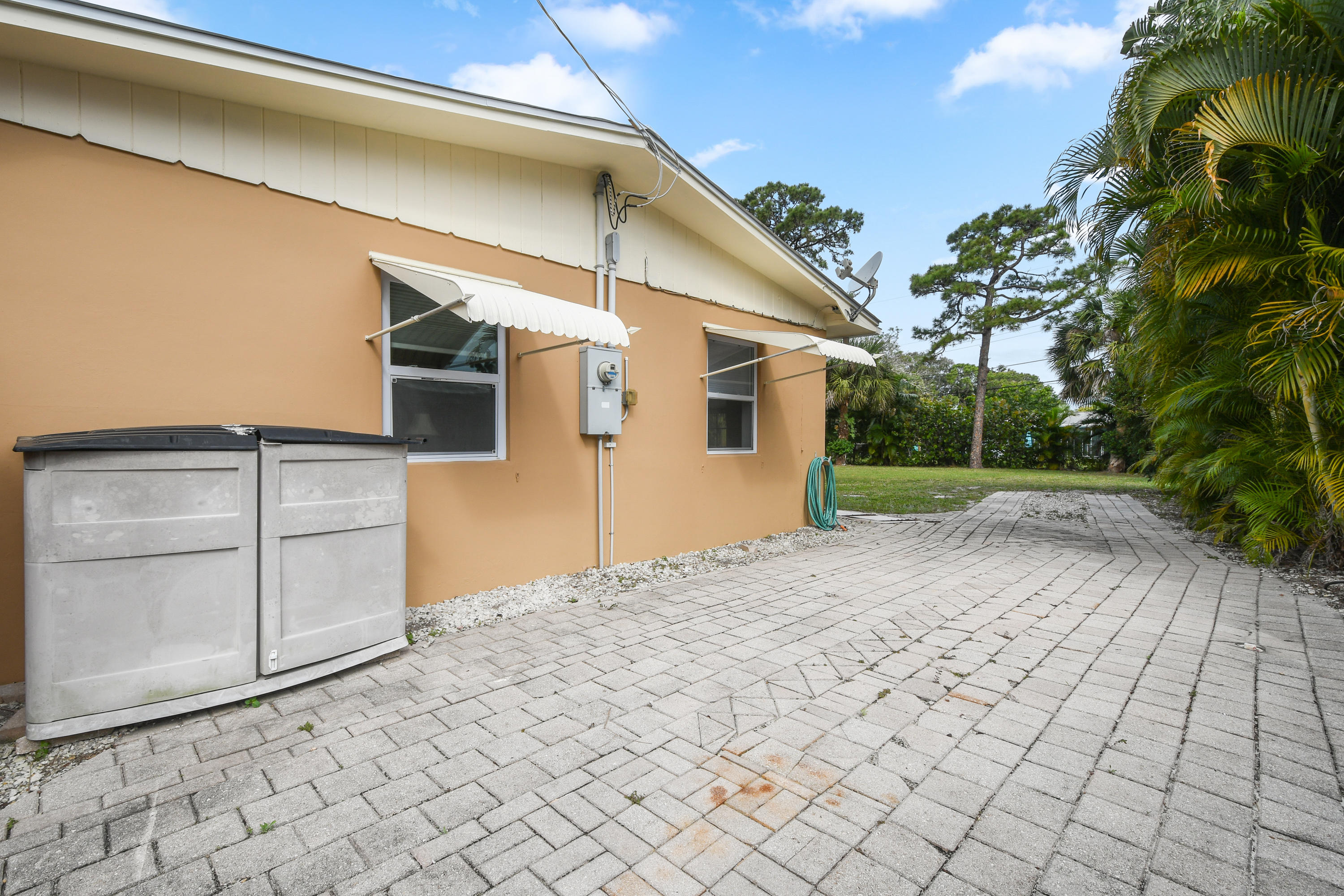 4885 Tequesta Drive Tequesta, FL 33469 - Photo 26 of 48 Boat/RV Pad on Side of Home