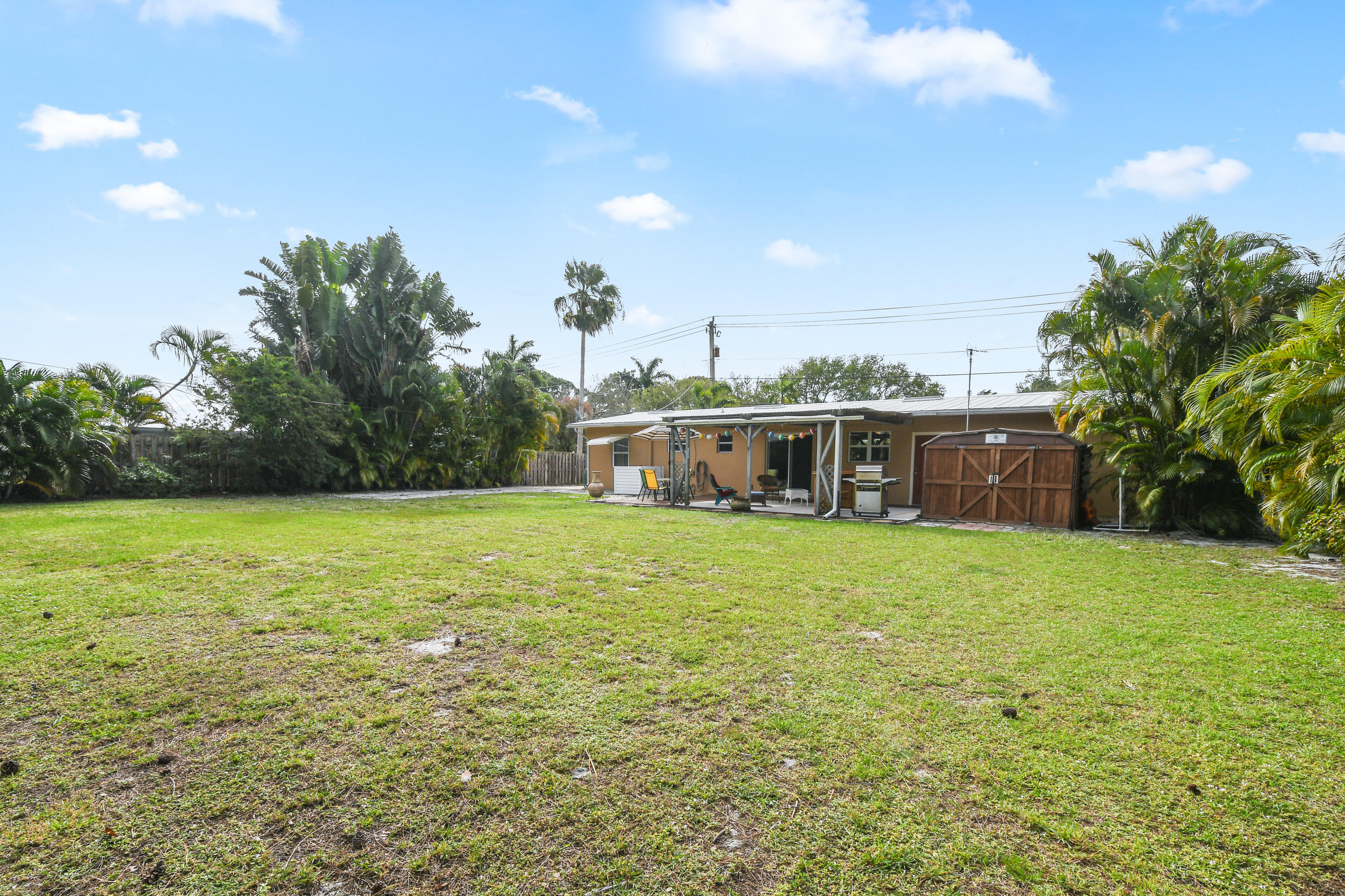 4885 Tequesta Drive Tequesta, FL 33469 - Photo 27 of 48 Rear View of Home