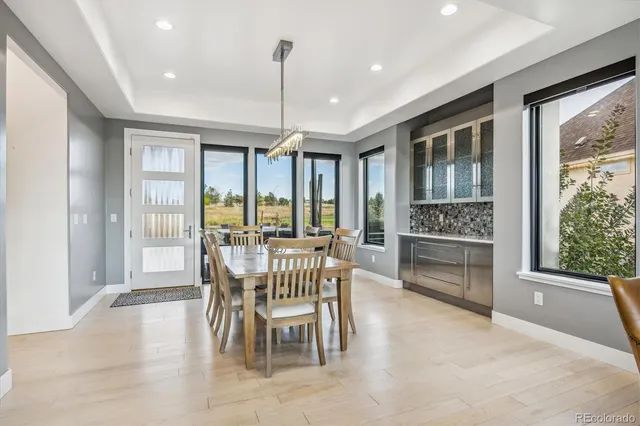 a view of a dining room with furniture window and outside view