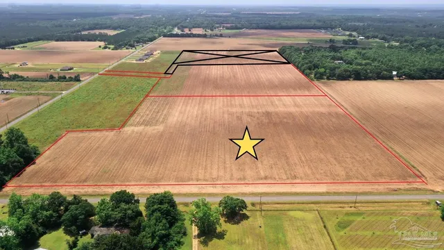an aerial view of a house with a swimming pool