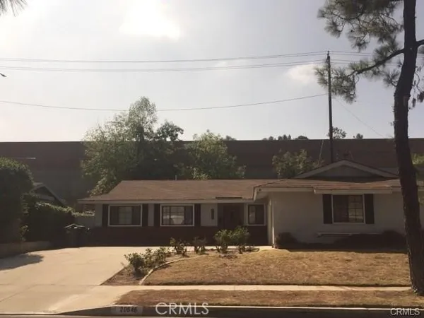 a front view of a house with yard