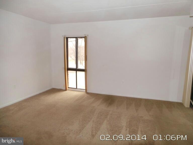 5253 West Running Brook Road, Unit 201 Columbia, MD 21044 - Photo 7 of 9 a view of an empty room with a window