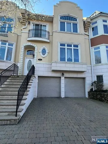 a front view of a building with many windows